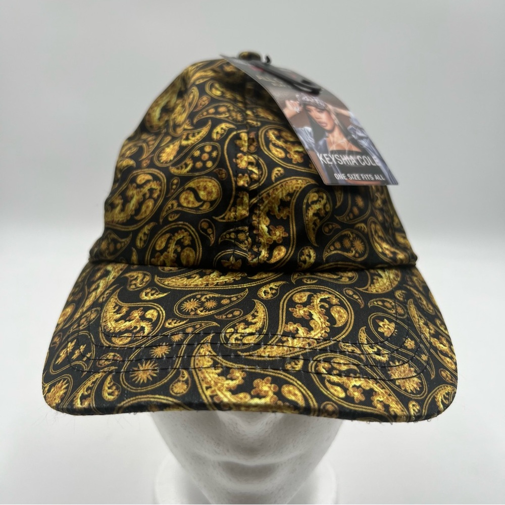 RED by KISS Keyshia Cole Satin Lined Baseball Cap. Black with gold paisley print
